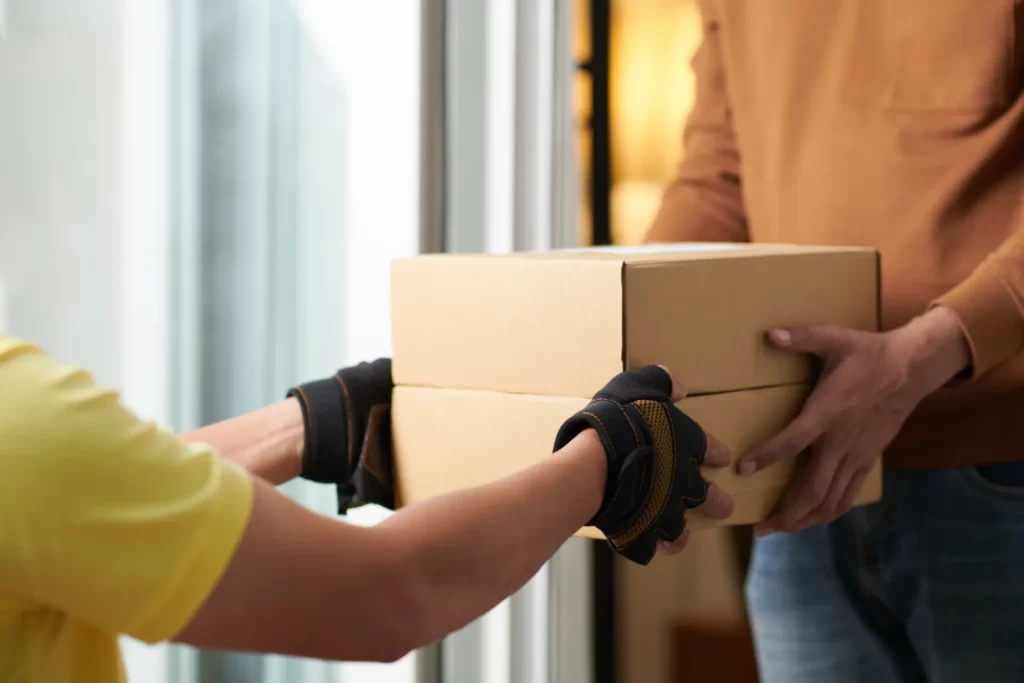 box delivery between two adults indoors during day utc ()