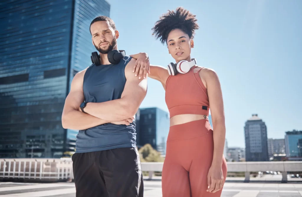 couple city portrait and fitness with headphones utc